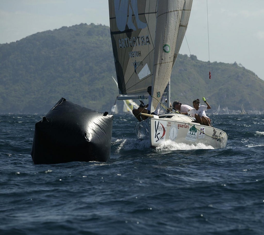 Moon Shadow (Sportsboats division) squeezes round the leeward mark, Race 5, Phuket King's Cup 2006 photo copyright Guy Nowell http://www.guynowell.com taken at  and featuring the  class