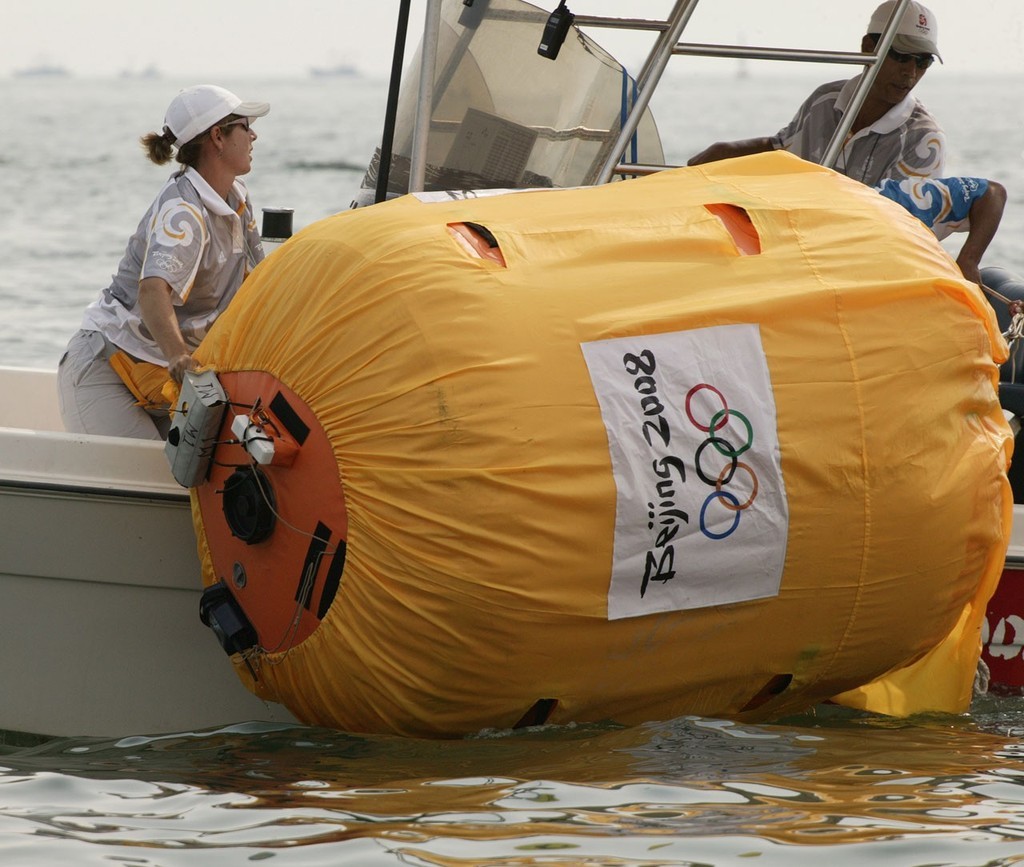 Qingdao Olympic Regatta 2008. ``We know darn well exactly where that mark is...`` (Should do with all that stuff on the top of it). photo copyright Guy Nowell http://www.guynowell.com taken at  and featuring the  class