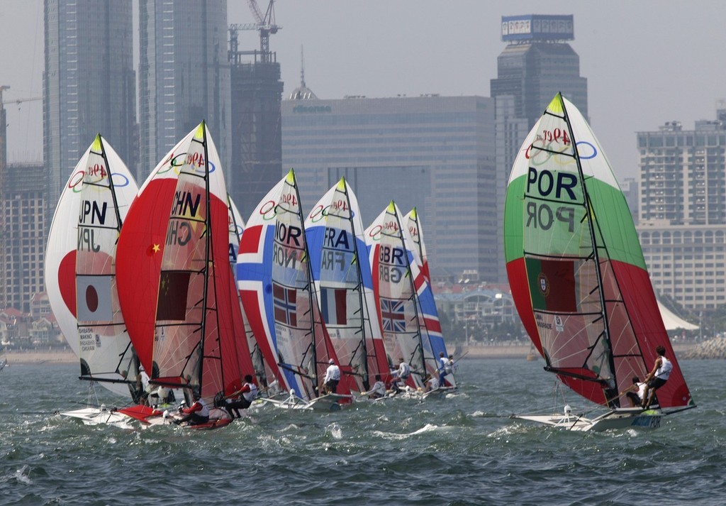 Qingdao Olympic Regatta 2008. 49er fleet heading towards an inshore gybe. photo copyright Guy Nowell http://www.guynowell.com taken at  and featuring the  class