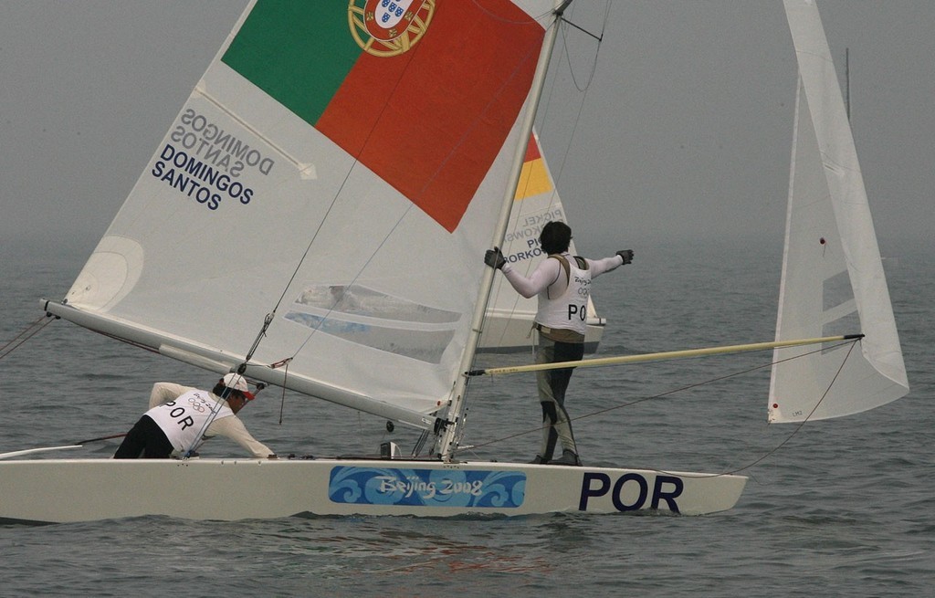 Qingdao Olympic Regatta 2008. ``Ummm that way, I think.`` Plantier Santos shows Domingos (POR) the way to the bottom mark. photo copyright Guy Nowell http://www.guynowell.com taken at  and featuring the  class