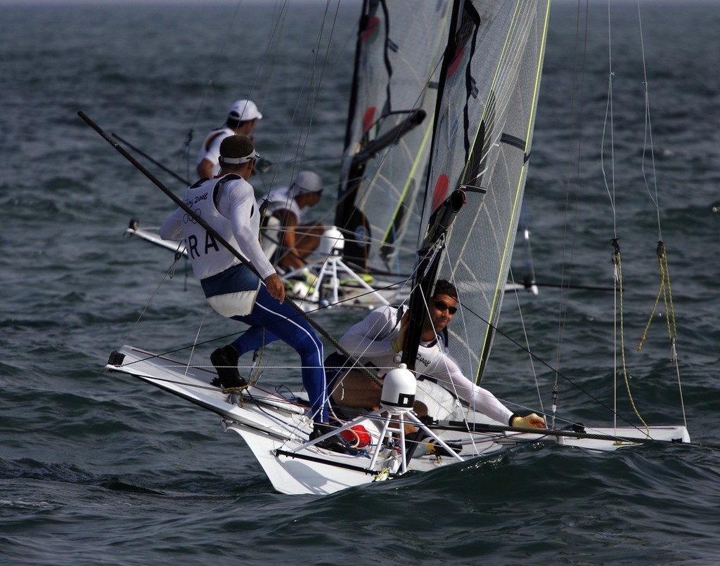 Qingdao Olympic Regatta 2008. 49ers... all angles. photo copyright Guy Nowell http://www.guynowell.com taken at  and featuring the  class