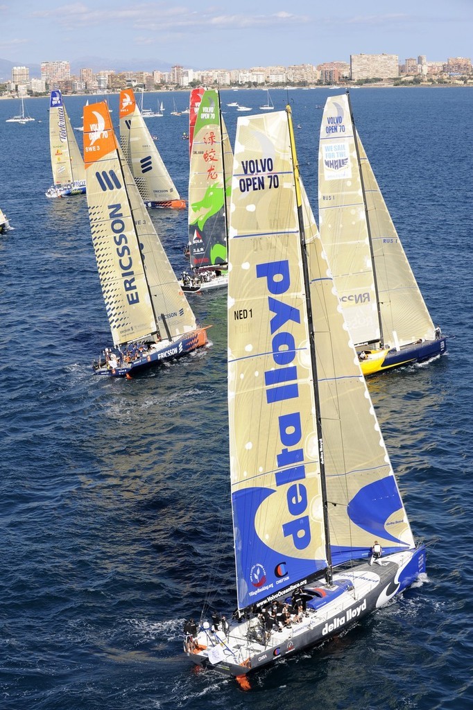 The fleet of 8 Volvo Open 70's power away from the start line in the first Volvo Ocean Race in-port race in Alicante, Spain. photo copyright Rick Tomlinson/Volvo Ocean Race http://www.volvooceanrace.com taken at  and featuring the  class