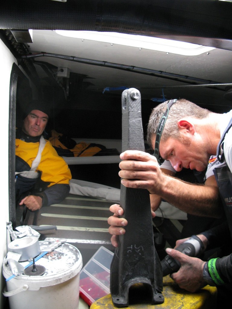 (l-r) Bouwe Bekking watches on as Xabier Fernandez and Pepe Ribes attempt to repair steering damage to Telefonica Blue which occured shortly after the start of leg 1. photo copyright Gabriele Olivo/Telefonica Blue/Volvo Ocean Race http://www.volvooceanrace.org taken at  and featuring the  class