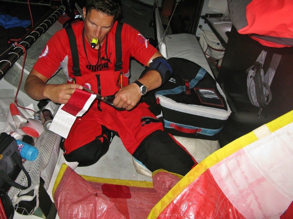 Rick Deppe/PUMA Ocean Racing. Justin Ferris (NZL) repairs the spinnaker onboard PUMA Ocean Racing’s il mostro on leg 1 of the Volvo Ocean Race photo copyright Volvo Ocean Race http://www.volvooceanrace.com taken at  and featuring the  class