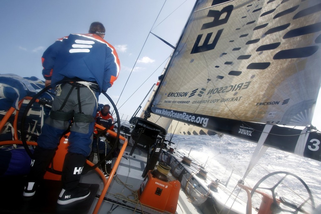 Gustav Morin/Ericsson Racing Team/Volvo Ocean Race. Mid-Bowman Anders Dahlsjö helming Ericsson 3, chasing the pack South during Leg 1. 

 photo copyright Volvo Ocean Race http://www.volvooceanrace.com taken at  and featuring the  class