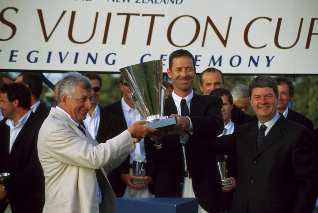 Patrizio Bertelli and Francesco de Angelis are presented with the Louis Vuitton Cup by Yves Carcelle (right) of Louis Vuitton in 2000. © Event Media