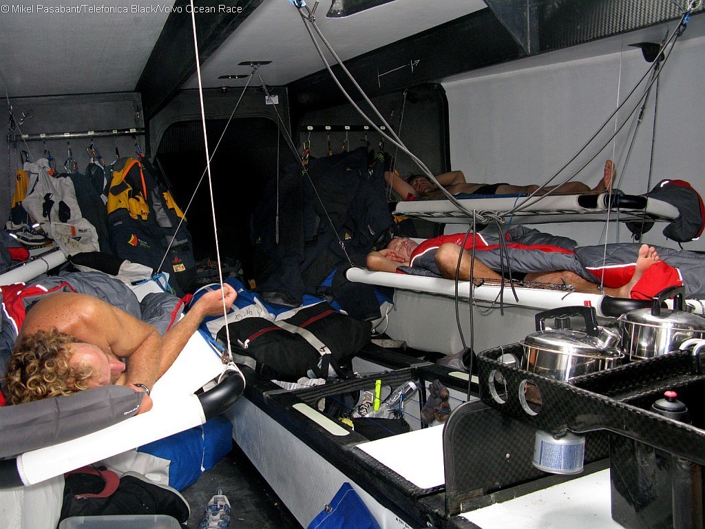 Some of the crew onboard Telefonica Black take a rest on leg 1 of the Volvo Ocean Race. - photo copyright Volvo Ocean Race http://www.volvooceanrace.com taken at  and featuring the  class