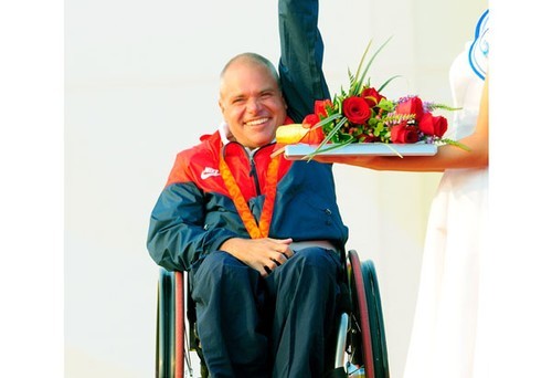 John Ruf of the USA waves after receiving his bronze medal in the 2.4 Metre - 2008 Paralympics - Qingdao © Sailing2008.com