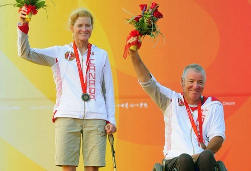 Stacie Louttit and John McRoberts of Canada accept their bronze medal in the SKUD18 sailing event<br />
 - 2008 Paralympics - Qingdao © Sailing2008.com
