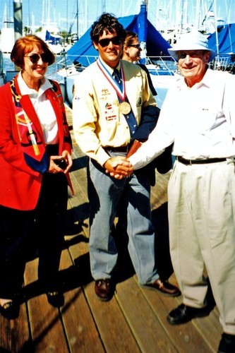 Hugh Poole and daughter congratulate Russell Coutts on his Gold medal win in the Finn class in 1984 © SW