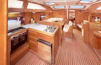 Bavaria 44 Vision - wider view of the Saloon with dining area forward and navigation position just visible aft on the starboard side. © International Marine Brokers New Zealand www.internationalmarine.co.nz