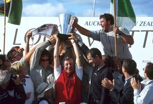 An elated Patrizio Bertelli holds the Louis Vuitton Cup aloft in 2000. © Event Media