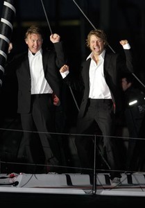 Alex and Andrew celebrating on the bow of Hugo Boss (Copyright onEdition/Barcelona World Race photo copyright onEdition http://www.onEdition.com taken at  and featuring the  class