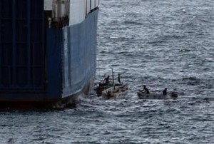 Somali Pirates photographed from US Navy ships who encircle the hijacked Faina photo copyright SW taken at  and featuring the  class