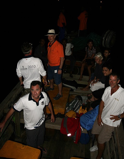Neptune Regatta 2011.  Loading up the refugee boat for the ride ashore. © Guy Nowell http://www.guynowell.com