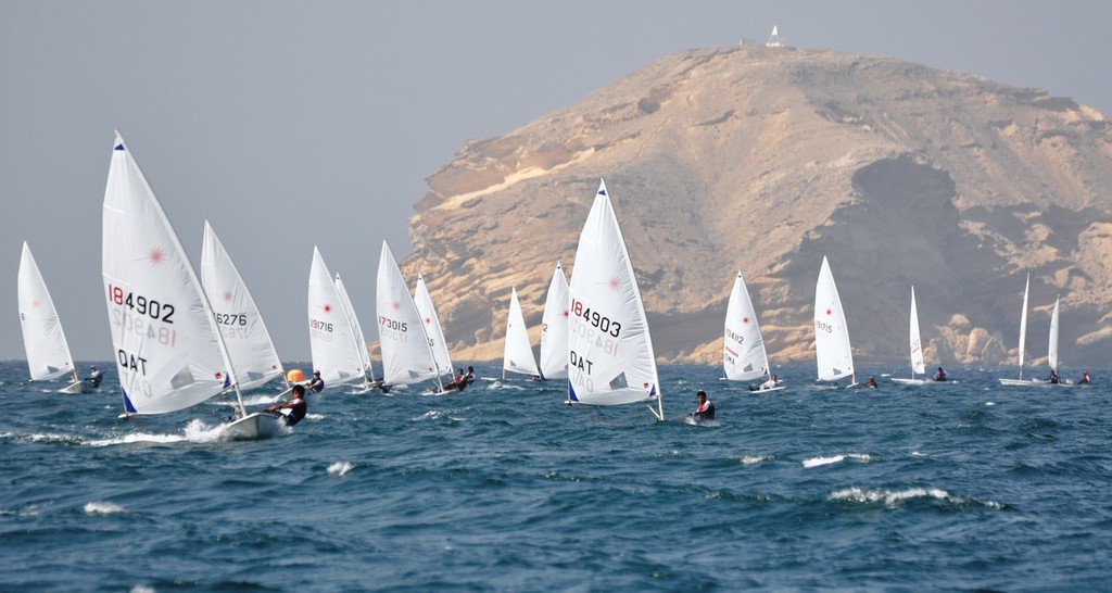 The fleet at full speed towards the down wind buoy with Al Fahal island in the background - VOLVO 2010 RAHBC OMAN OPEN LASER CHAMPIONSHIP © Mark Rhodes