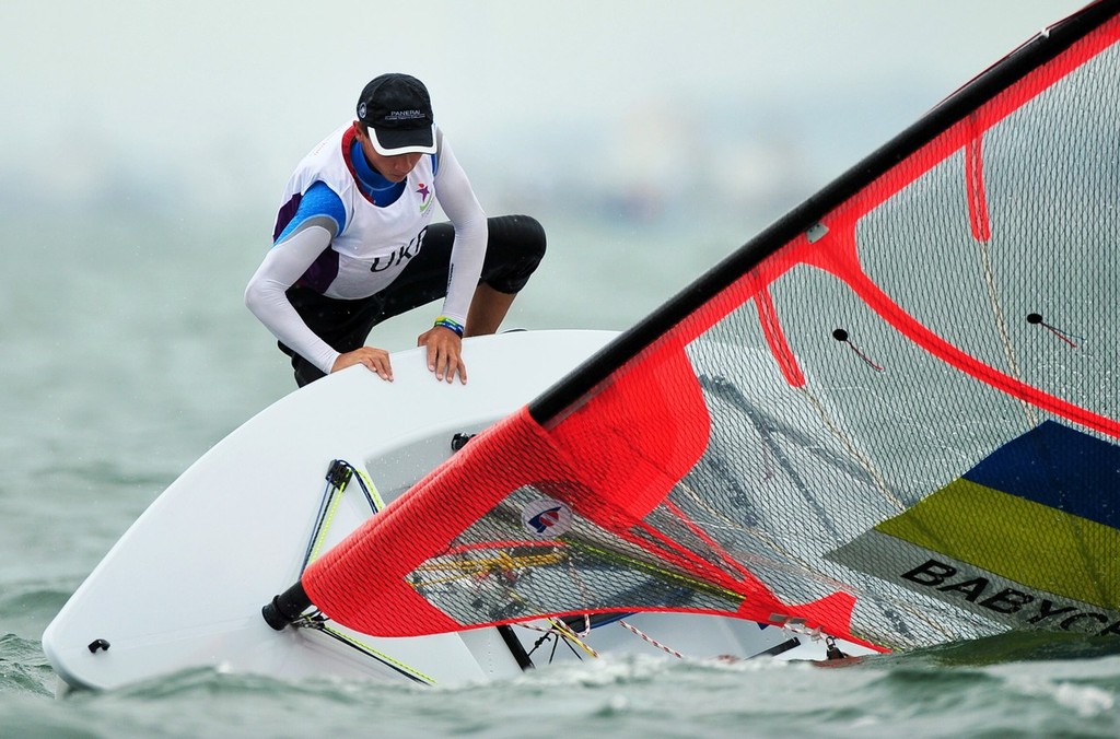 Ukraine's Pavlo Babych takes a spill while rounding a mark in the Byte CII One Person Dinghy race 6 of the Singapore 2010 Youth Olympic Games held at the National Sailing Centre on Aug 20, 2010. He recovered and went on to finish 18th overall in 6 races. photo copyright ISAF  taken at  and featuring the  class