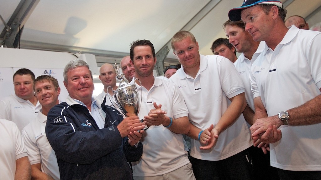 ENGLAND, Cowes, 6th August 2010. 1851 Cup Regatta. Day 4. Sir Keith Mills, Team Principal of TEAMORIGIN holds the Trafalgar Cup, won by TEAMORIGIN at the 1851 Cup Regatta. photo copyright Ian Roman/TEAMORIGIN www.ianroman.com taken at  and featuring the  class