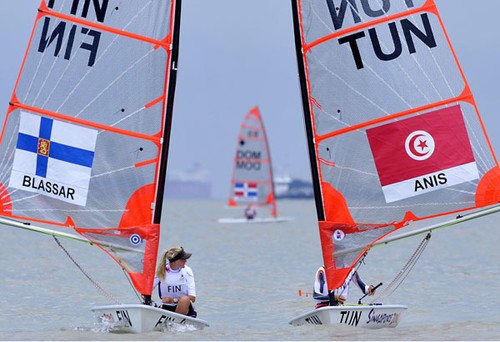 Niki Blassar(left) having a conversation with Anis Elmjid of Tunisia(right) just before the start of both Byte CII- Boys and girls One Person Dinghy race 3 at the Singapore 2010 Youth Olympic Games (YOG) on Aug 18, 2010 at the National Sailing Centre. He finished second position at race four. Photo: SPH-SYOGOC/Imran Ahmad © ISAF 