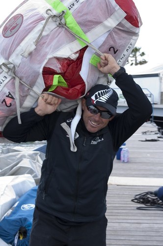 Emirates Team New Zealand tactician Ray Davies unloads sails after the practice race for the Audi Med premier regatta in Cascais, Portugal.  © Chris Cameron/ETNZ http://www.chriscameron.co.nz