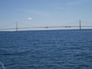 The Straits of Mackinac go under the Mackinac Bridge photo copyright SW taken at  and featuring the  class