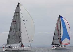 Ultimate Positioning chases The Matrix in race two of the series - Ensign Yachts QLD Beneteau Cup photo copyright Tracey Johnstone taken at  and featuring the  class