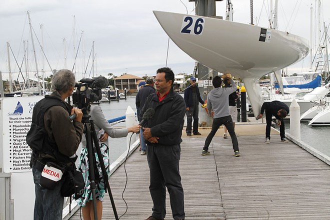Busy on the marina with media interviews, whilst Team Barry prepare to launch. - Musto Australasian Etchells Winter Championships 2011 © Teri Dodds http://www.teridodds.com