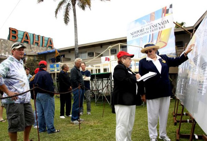 Scorers Toni Baiunco (red cap) and Patty Cook bring scoreboard up to date - Newport to Ensenada © Rich Roberts http://www.UnderTheSunPhotos.com