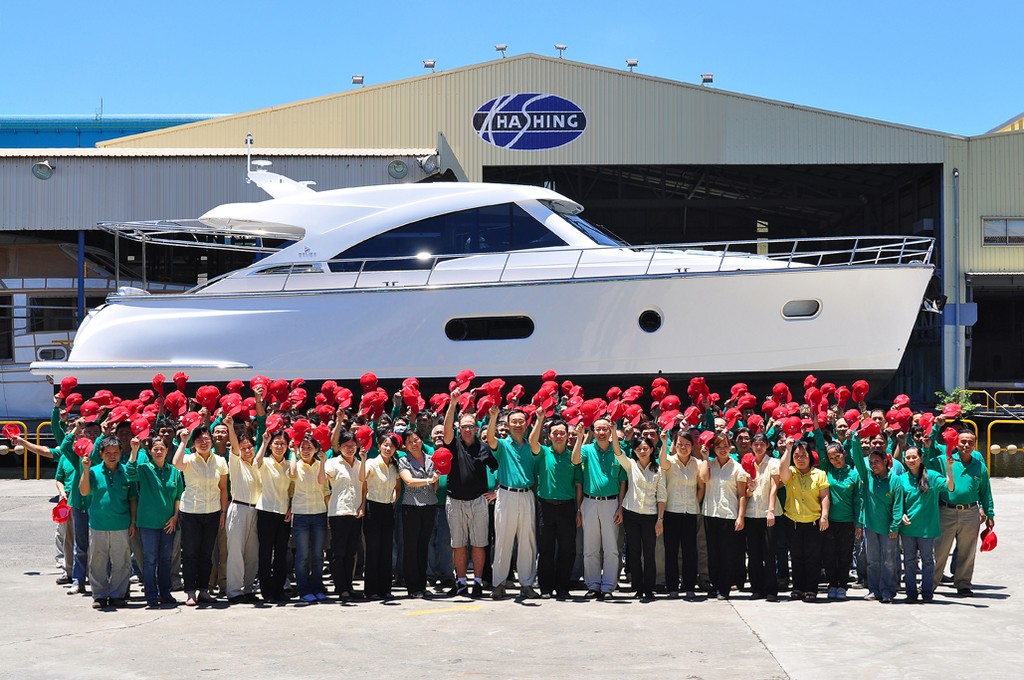 Factory workers in Taiwan were given red hats to celebrate the completion of hull No1. photo copyright Belize Yachts taken at  and featuring the  class