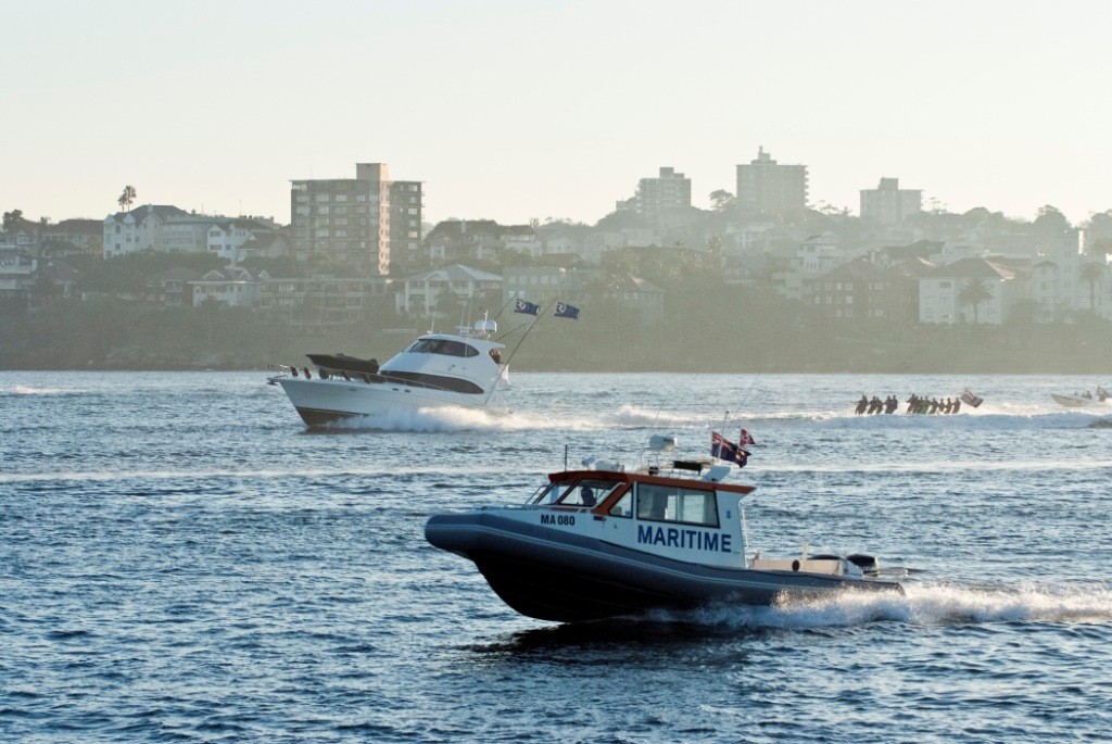 Mazara makes the dash across the Harbour with skiers in tow. photo copyright Riviera . http://www.riviera.com.au taken at  and featuring the  class