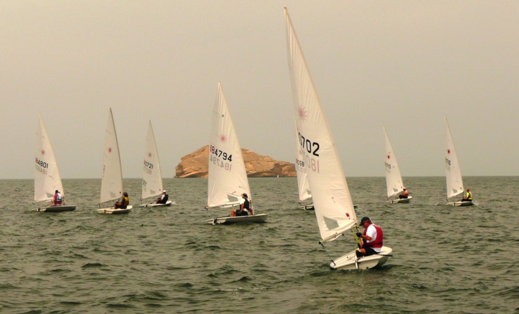 The fleet towards the up-wind buoy with Al Fahal island in the background - VOLVO 2011 RAHBC OMAN OPEN LASER CHAMPIONSHIP photo copyright Various Various taken at  and featuring the  class