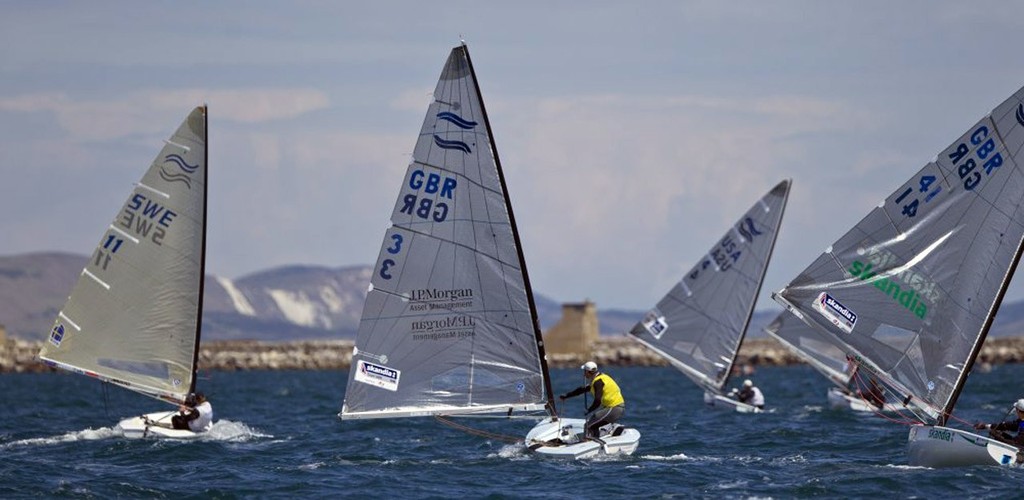 Ben Ainslie from Great Britain winning the Gold Medal, beating Giles Scott, in the Finn class on the medal day of the Skandia Sail for Gold Regatta, in Weymouth and Portland, the 2012 Olympic venue. © onEdition http://www.onEdition.com