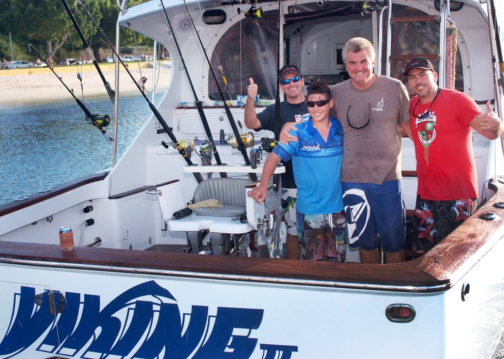 The 2011 Luhrs Billfish Shootout Champion Junior Angler, Connor Craven with (left to right) David Finns, skipepr Captain Bill Billson and proud father Glenn Craven. photo copyright BlueWater Power Yachts taken at  and featuring the  class