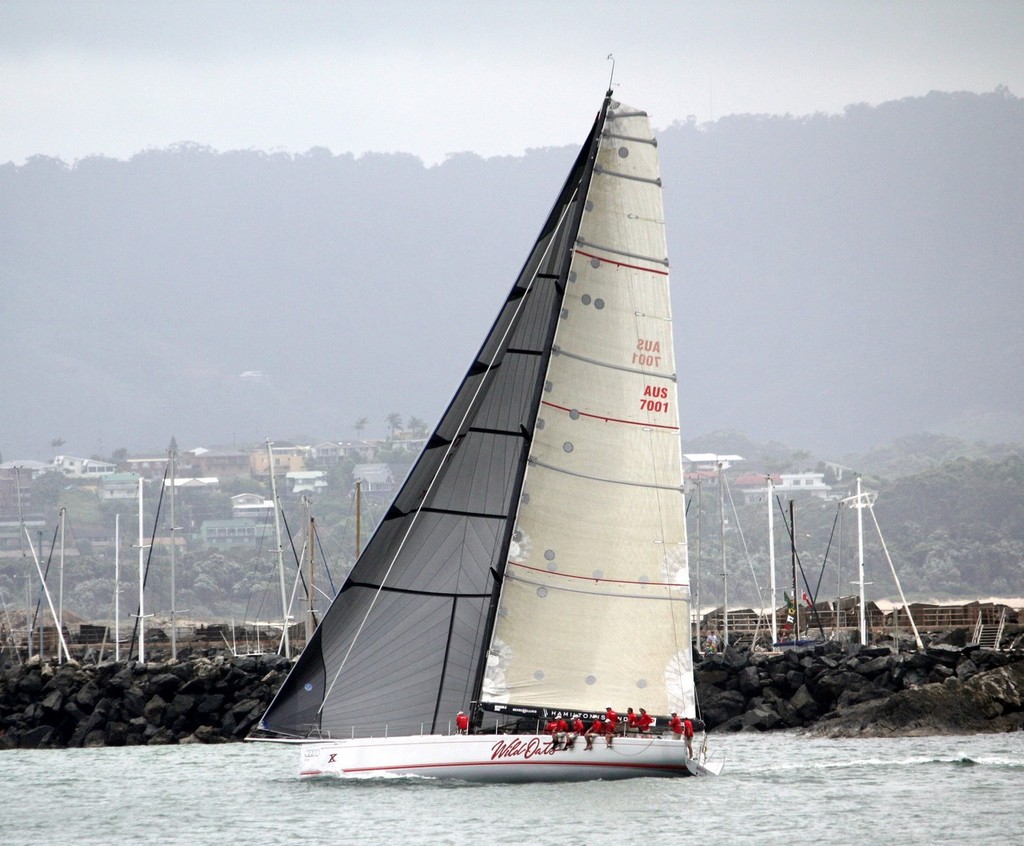 Bob Oatley's 66ft RP 'Wild Oats X' skippered by Mark Richards crosses the finish line in Coffs Harbour to take line honours in the 2011 race  - 2012 Pittwater & Coffs Harbour Regatta & Rally photo copyright Damian Devine taken at  and featuring the  class