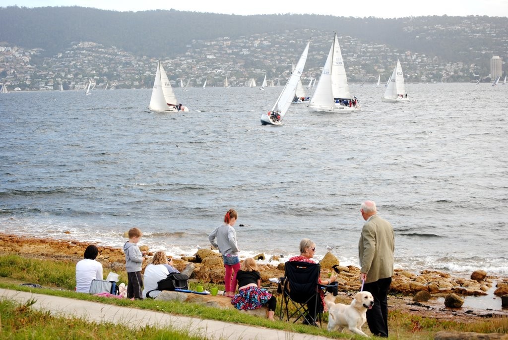  Spectators line Victoria Esplanade at Bellerive to watch the huge fleet of keelboats racing.   - twilight race on the River Derwent – the ‘100 boat challenge’ which attracted 133 starters photo copyright  Andrea Francolini Photography http://www.afrancolini.com/ taken at  and featuring the  class