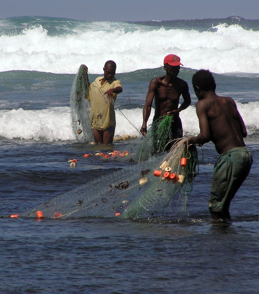 Fishermen setting a net in the coral reef lagoon of Kenya - Leaders urged to curb climate vulnerability photo copyright Joshua Cinner taken at  and featuring the  class
