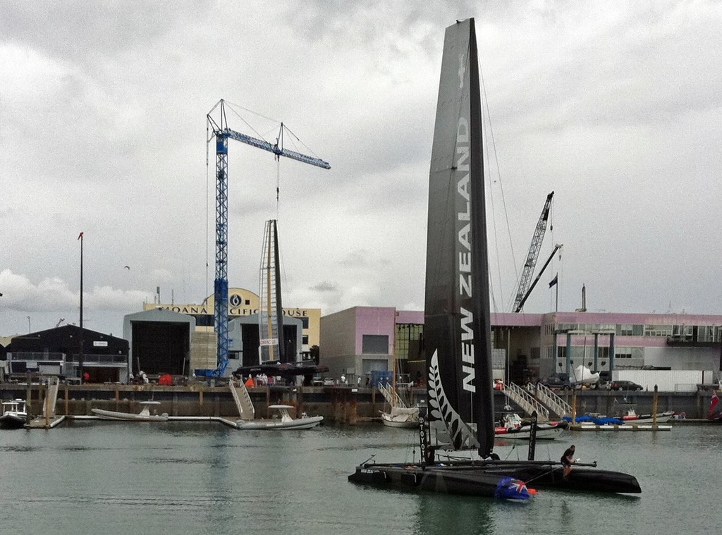 Emirates Team NZ on the mooring while Oracle Racing awaits her wingsail © Richard Gladwell www.photosport.co.nz