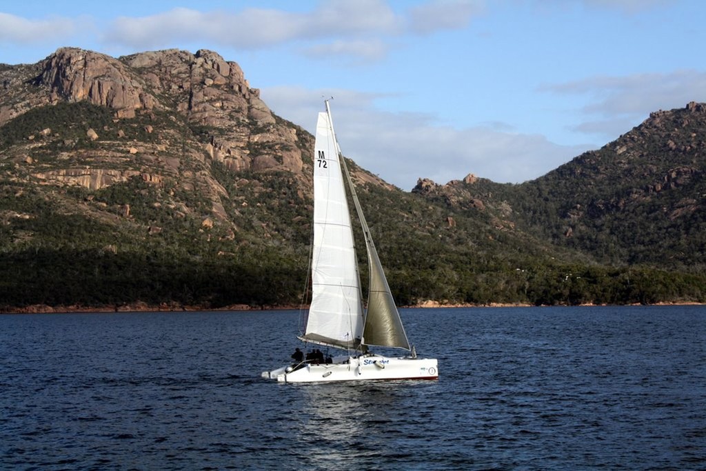 Slingshot sail out of Coles Bay past The Hazards - Australian Three Peaks Race © Kate Phibbs