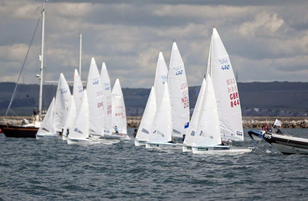 The 470 Men class fleet prepare to race on the medal day of the Skandia Sail for Gold Regatta, in Weymouth and Portland, the 2012 Olympic venue. © onEdition http://www.onEdition.com