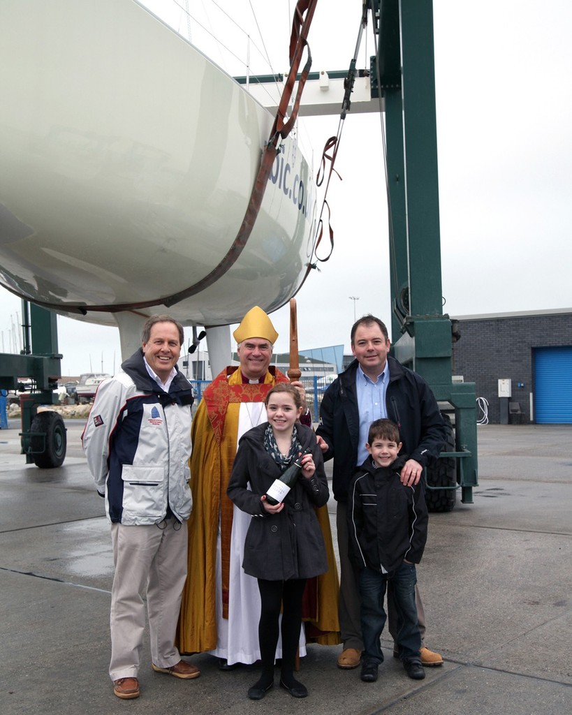 left to right John Tweed, Chief Executive of the Weymouth and Portland National Sailing Academy, The Bishop of Sherborne and Charlie Walker, Managing Director of the Round Britain and Ireland Challenge with his children photo copyright Helen Ellis taken at  and featuring the  class