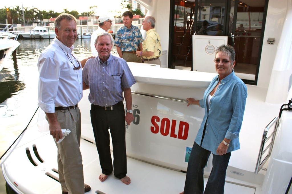 Maritimo USA&rsquo;s John McCarthy (left) with two happy new owners. photo copyright Bob Wonders taken at  and featuring the  class