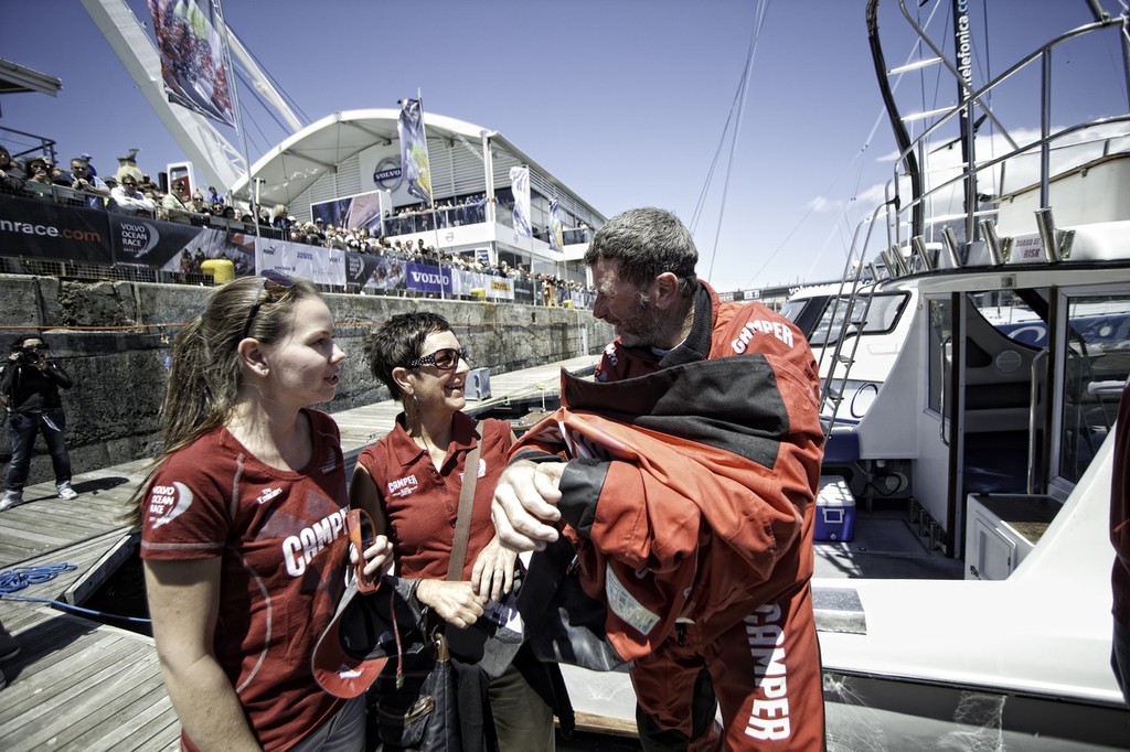 Rob Salthouse from New Zealand with his family. CAMPER with Emirates Team New Zealand, skippered by Chris Nicholson from Australia finishes second on leg 1 of the Volvo Ocean Race 2011-12 from Alicante, Spain to Cape Town, South Africa, at 10:48:04 UTC. (Photo Credit must read: PAUL TODD/Volvo Ocean Race) photo copyright Paul Todd/Volvo Ocean Race http://www.volvooceanrace.com taken at  and featuring the  class