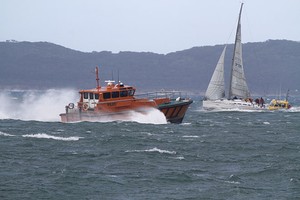 Pilot Boat passing Sandringham's White Noise as she crosses the start line - ORCV Melbourne to Apollo Bay Race 2011 (amended to Port Phillip Bay Race) photo copyright Teri Dodds http://www.teridodds.com taken at  and featuring the  class