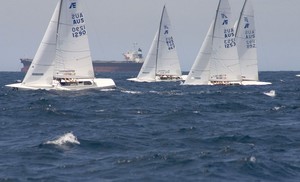The fleet sails past one of Newcastle's landmarks - Bulk Carriers. - 2011 NSW Etchells State Championships photo copyright  John Curnow taken at  and featuring the  class