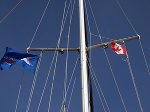 Canadian Flag flying high photo copyright Meghan Cleary taken at  and featuring the  class