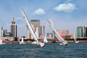 Yacht racing in front of the Qingdao skyline - Extreme Sailing Series photo copyright Extreme Sailing Series - Asia http://www.extremesailingseriesasia.com/ taken at  and featuring the  class