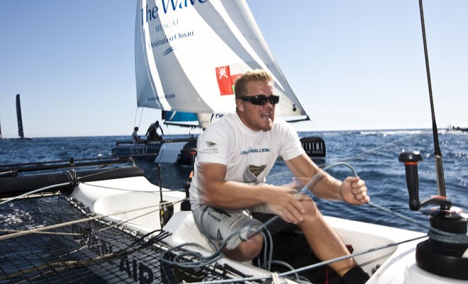 David Carr in action onboard Oman Air<br />
 - Extreme Sailing Series Act 8 2011 © Lloyd Images http://lloydimagesgallery.photoshelter.com/
