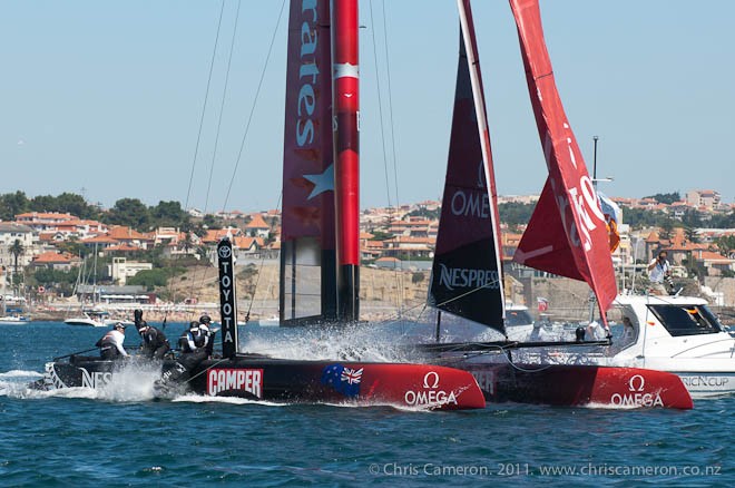 Emirates Team New Zealand in the 40 minute race of the preliminaries for the first America’s Cup World Series event in Cascais. Bowman Winston Macfarlane goes overboard when a winch handle breaks as he grinds in the Gennaker sheet. 7/8/2011 - America’s Cup World Series - Day 2 - Cascais © Chris Cameron/ETNZ http://www.chriscameron.co.nz