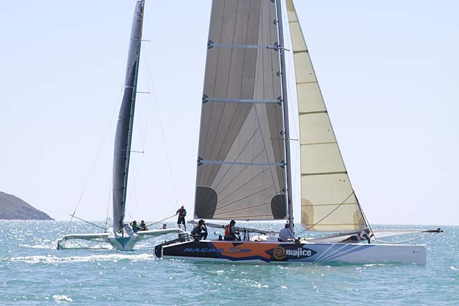 Multihulls Trilogy and Malice crossed paths on route to the finish in Pioneer Bay - Meridien Marinas Airlie Beach 22nd Annual Race Week 2011 © Teri Dodds - copyright http://www.teridodds.com