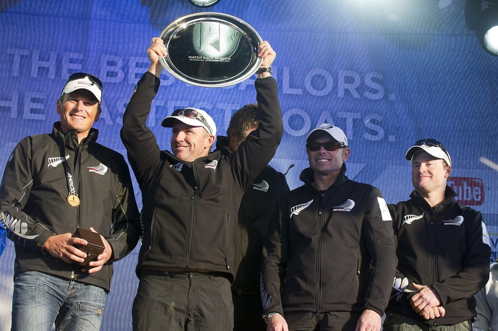 Emirates Team New Zealand sailors Dean Barker, Ray Davies, Winston Macfarlane, James Dagg and Glenn Ashby  receive their first place trophy and medals on stage at the presentation for the match racing stage of the America’s Cup World Series in Plymouth.  © Chris Cameron/ETNZ http://www.chriscameron.co.nz